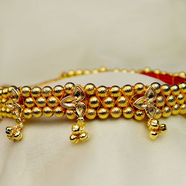 Traditional Kolhapuri Chinchpeti gold choker with Belpan design for bridal look.