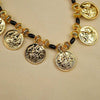 Handcrafted Kolhapuri mangalsutra with gold coin design and black beads.
