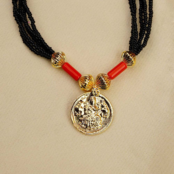 Kolhapuri mangalsutra embedded with gold Lakshmi coins and black beads.