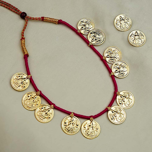 Traditional Kolhapuri necklace with goddess Lakshmi coins and intricate design.