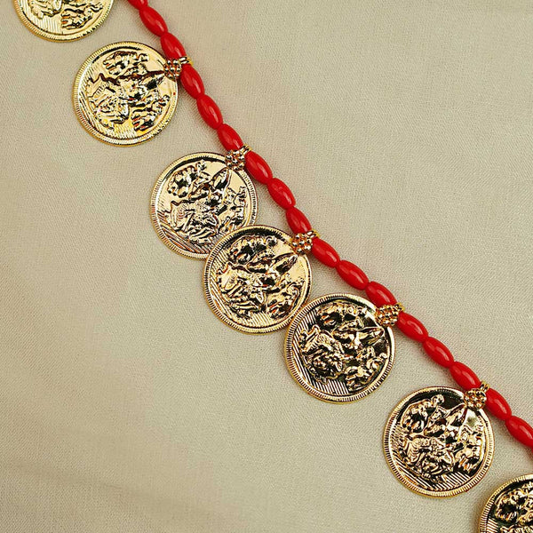 Maharashtrian gold necklace with powla beads and coin detailing.