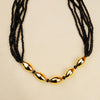 Golden mangalsutra featuring a traditional Bormaal pendant with black beads.