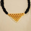 Maharashtrian Tanmani-style mangalsutra with gold pendant and black beads.