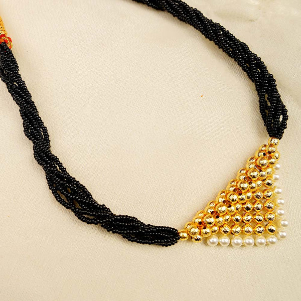 Maharashtrian Tanmani-style mangalsutra with gold pendant and black beads.