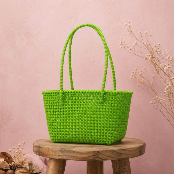 Kalapuri handmade parrot green Koodai tote bag, front view on plain background