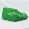 Close-up of woman holding Kalapuri bright green Koodai tote bag handle
