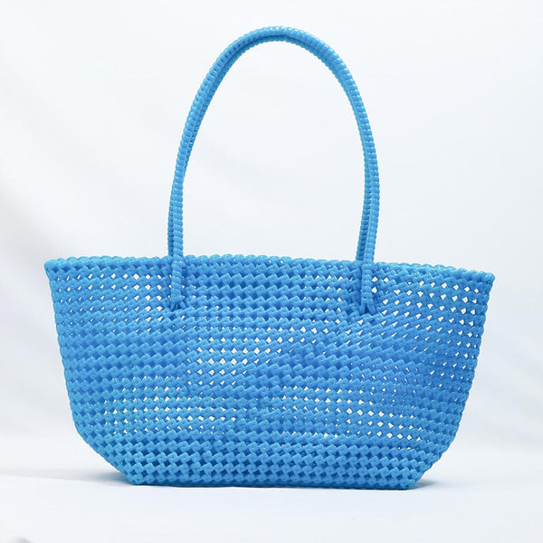Kalapuri handmade sky blue Koodai tote bag on wooden stool with dried flowers