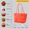 Kalapuri handmade orange Koodai tote bag, angled view showing woven texture