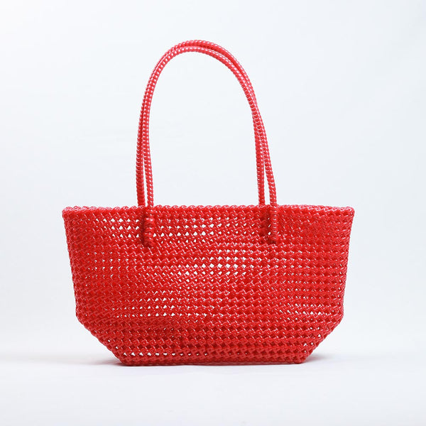 Kalapuri handmade red Koodai tote bag on wooden stool with dried flowers