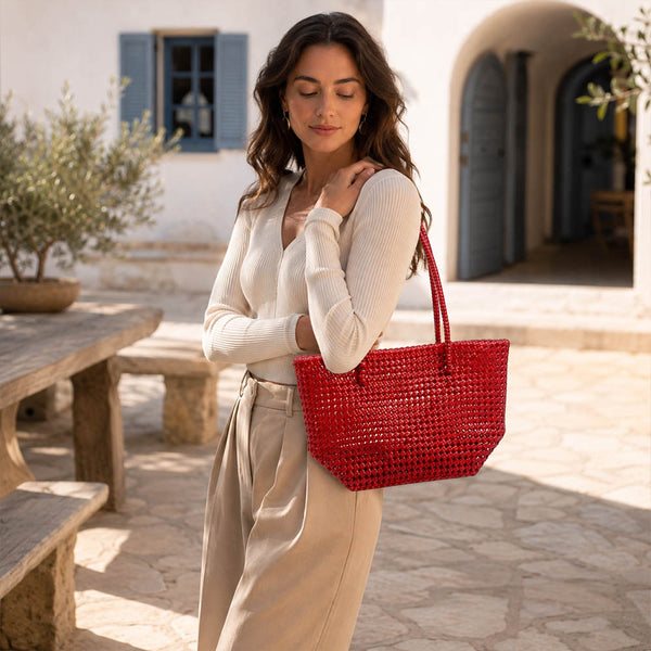Close-up of handwoven handle detail on Kalapuri red Koodai tote bag