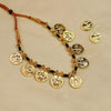 Handcrafted Kolhapuri mangalsutra with gold coin design and black beads.