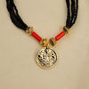 Kolhapuri mangalsutra embedded with gold Lakshmi coins and black beads.