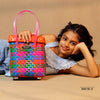 Kalapuri handmade multicolor basket with grey lid vibrant woven storage solution.