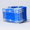 Blue and white handwoven half basket with lid for stylish home storage