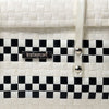 Black and white modern handwoven half basket with lid