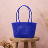 Kalapuri handmade royal blue Koodai tote bag, front view on plain background