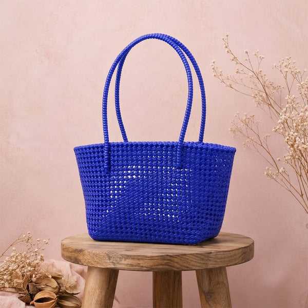 Kalapuri handmade royal blue Koodai tote bag, front view on plain background