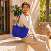 Close-up of handwoven handle detail on Kalapuri royal blue Koodai tote bag