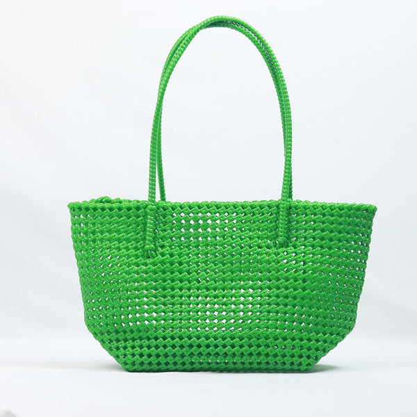 Kalapuri handmade bright green Koodai tote bag on wooden stool with dried flowers