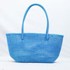 Kalapuri handmade sky blue Koodai tote bag on wooden stool with dried flowers