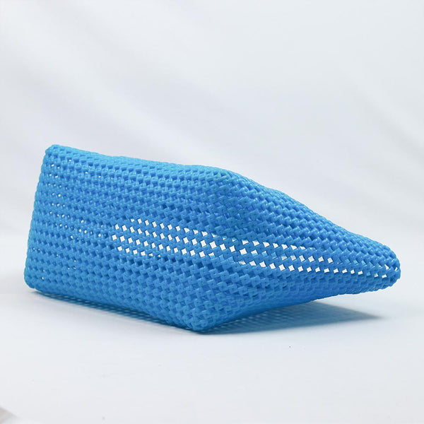 Close-up of woman holding Kalapuri sky blue Koodai tote bag handle