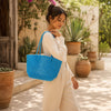 Close-up of handwoven handle detail on Kalapuri sky blue Koodai tote bag
