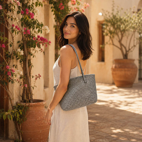 Close-up of handwoven handle detail on Kalapuri gray Koodai tote bag