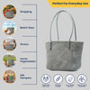Kalapuri handmade gray Koodai tote bag, angled view showing woven texture