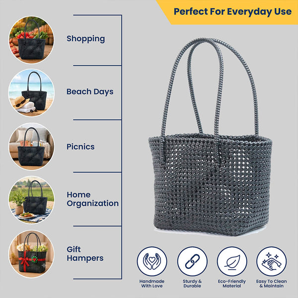 Kalapuri handmade black Koodai tote bag, angled view showing woven texture