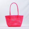 Kalapuri handmade pink Koodai tote bag on wooden stool with dried flowers