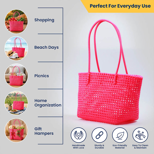 Kalapuri handmade pink Koodai tote bag, angled view showing woven texture