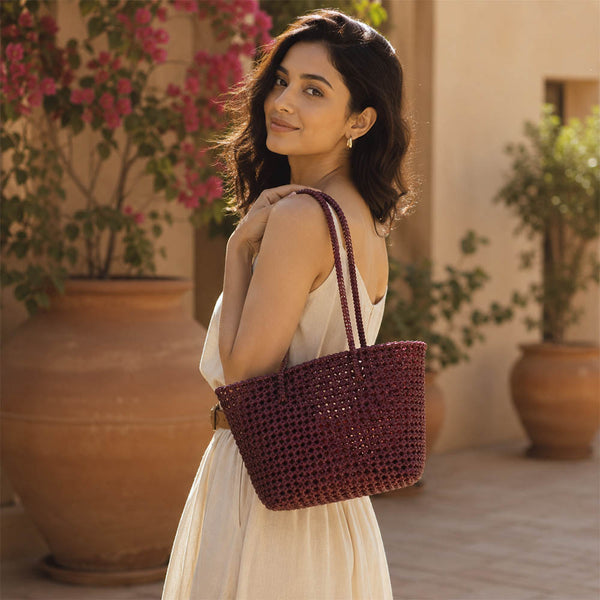 Close-up of handwoven handle detail on Kalapuri maroon Koodai tote bag
