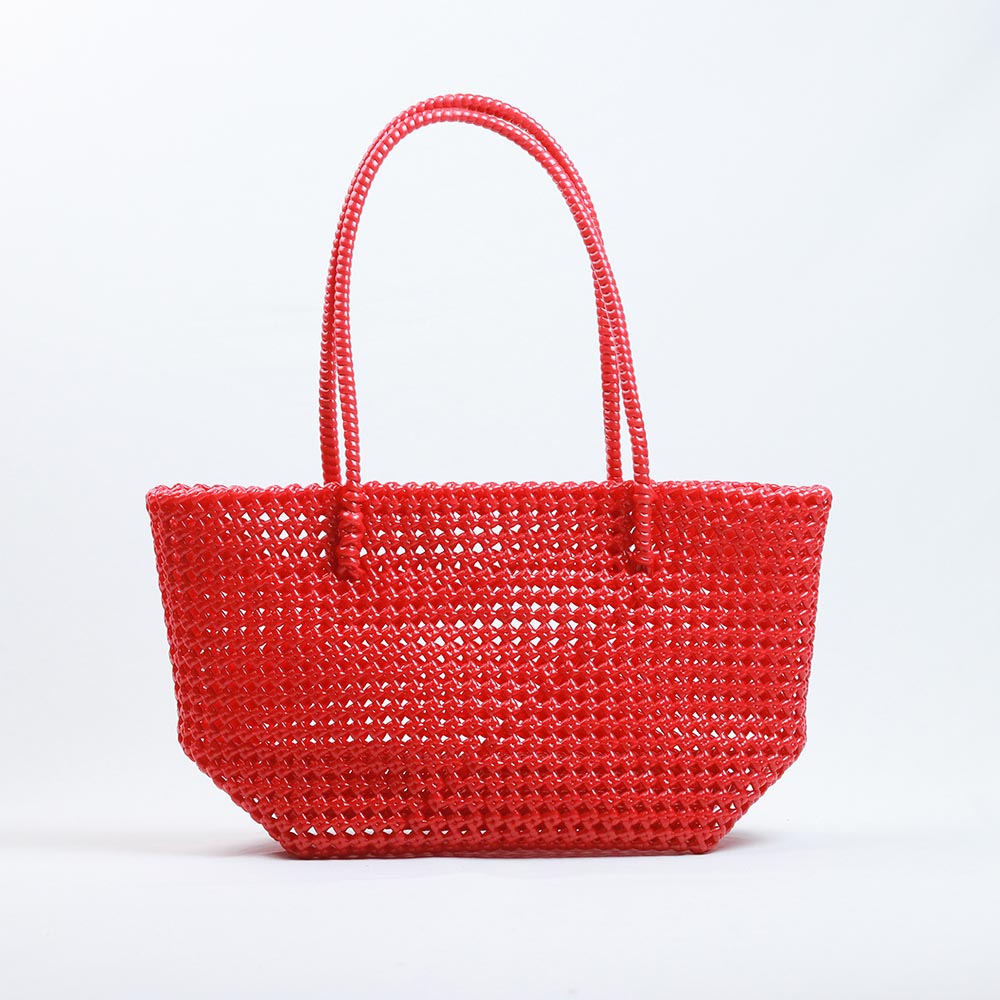 Kalapuri handmade red Koodai tote bag on wooden stool with dried flowers
