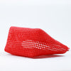 Close-up of woman holding Kalapuri red Koodai tote bag handle