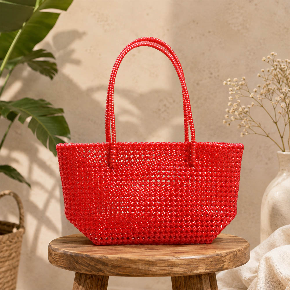 Kalapuri handmade red Koodai tote bag, front view on plain background