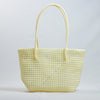 Kalapuri handmade cream Koodai tote bag on wooden stool with dried flowers