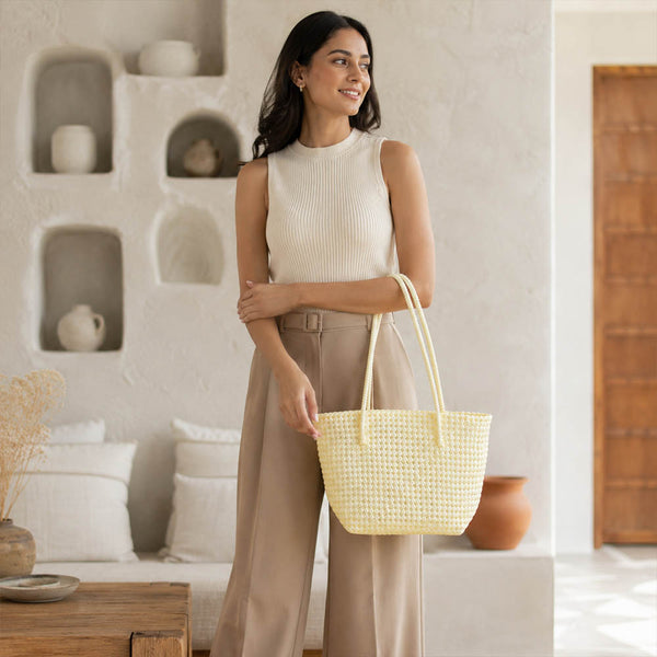 Close-up of handwoven handle detail on Kalapuri cream Koodai tote bag