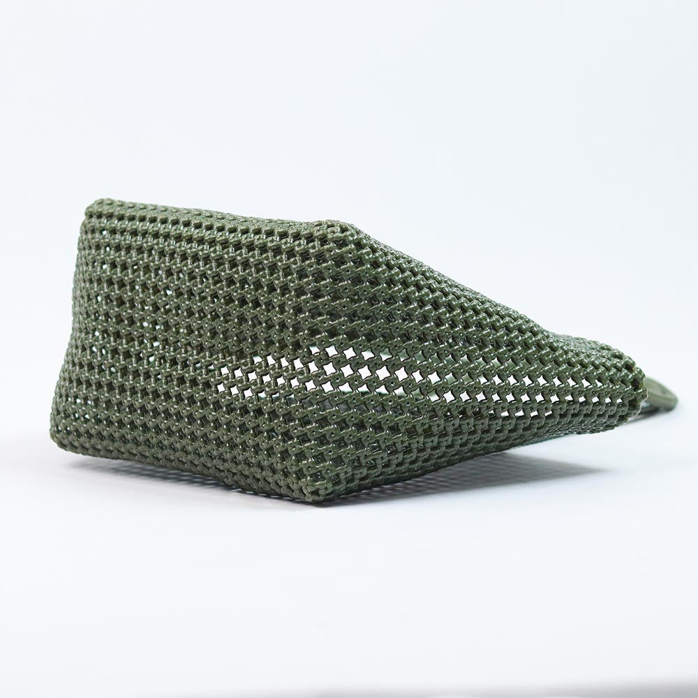 Close-up of woman holding Kalapuri olive green Koodai tote bag handle