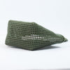 Close-up of woman holding Kalapuri olive green Koodai tote bag handle