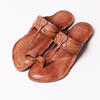 Pair of brown sandals on a white background