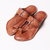 Pair of brown sandals on a white background
