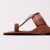Brown sandal with a woven design on a light gray background