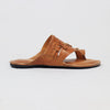 Brown sandal with black sole on a light gray background
