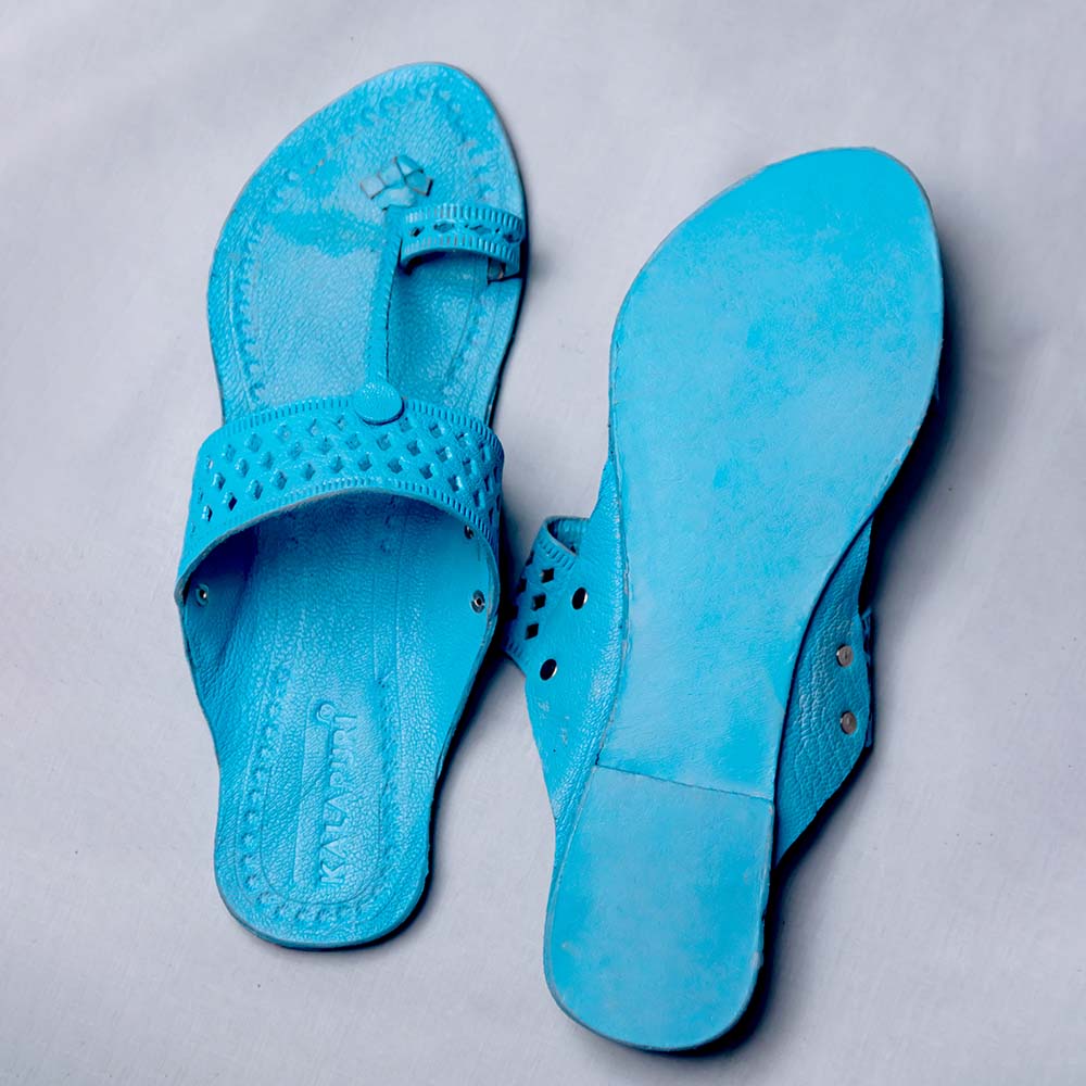 In cheap blue chappals