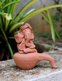 Ganesha Idol beautifully adorned on a Veena.
