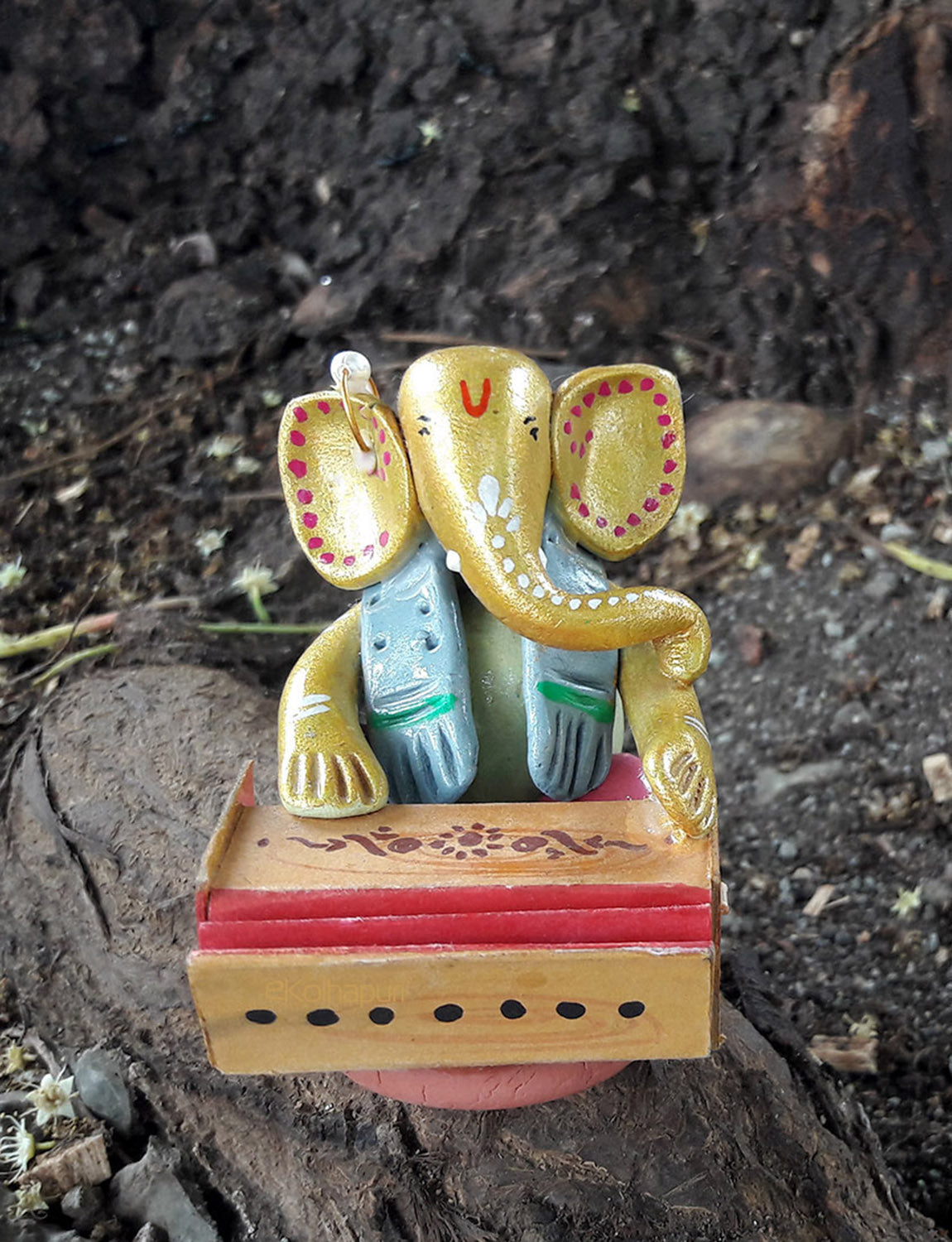 Multicoloured Handcrafted Ganesha Idol with Harmonium.