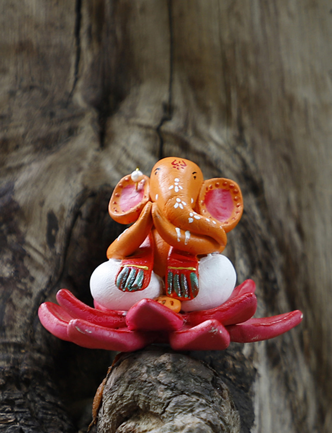 Multicoloured Ganpati Idol on Lotus.