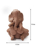 Beige Terracotta Ganesha playing tabla