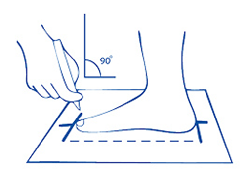 Tracing the outline of a foot on paper with the pencil held upright